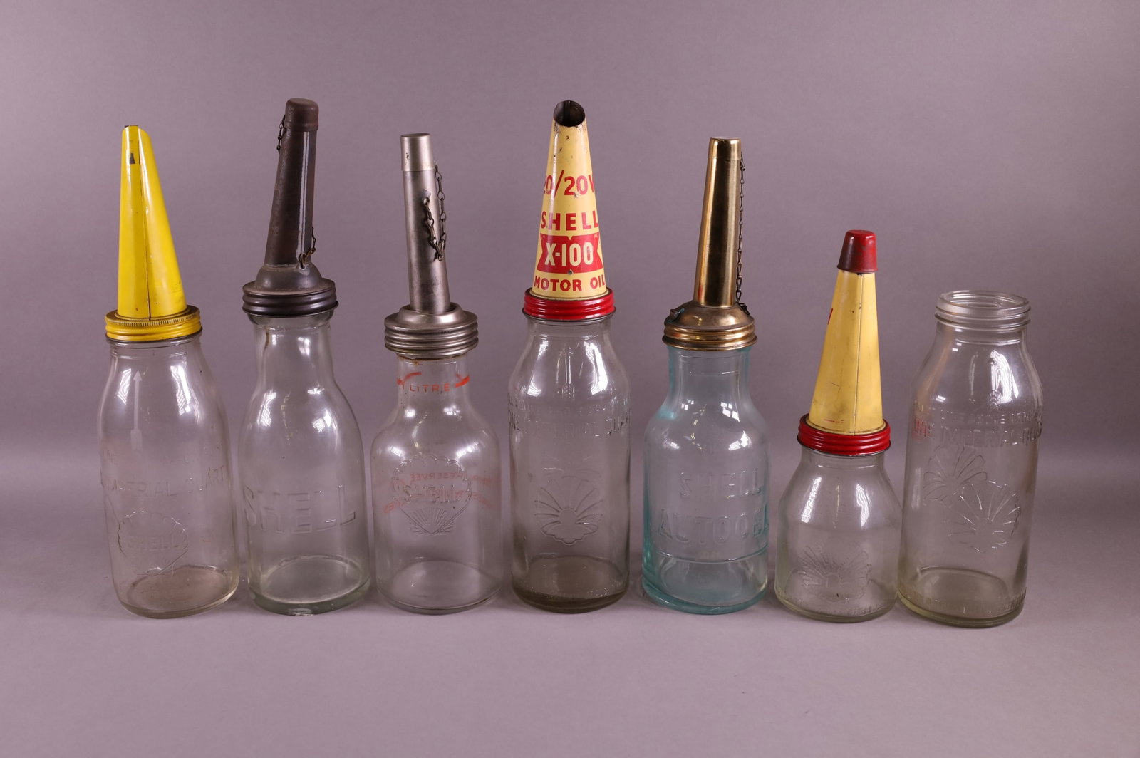 SEVEN SHELL OIL BOTTLES (1 of 4)