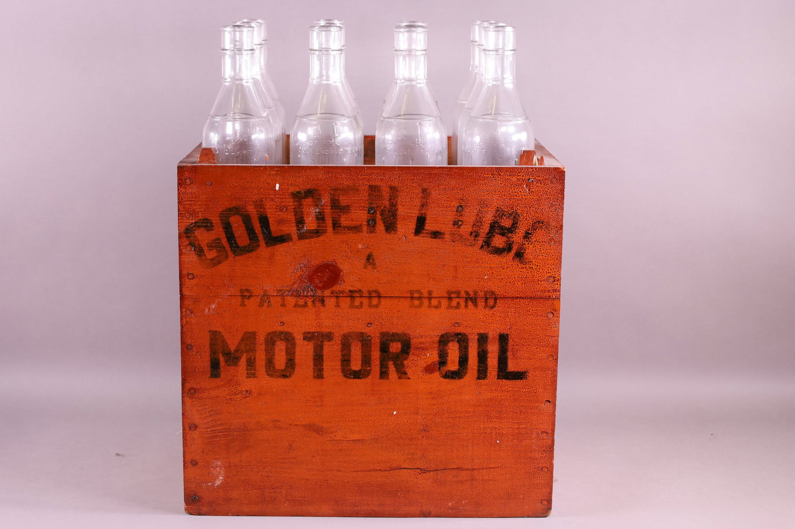 TWELVE OIL BOTTLES IN GOLDEN LUBE RACK (1 of 3)