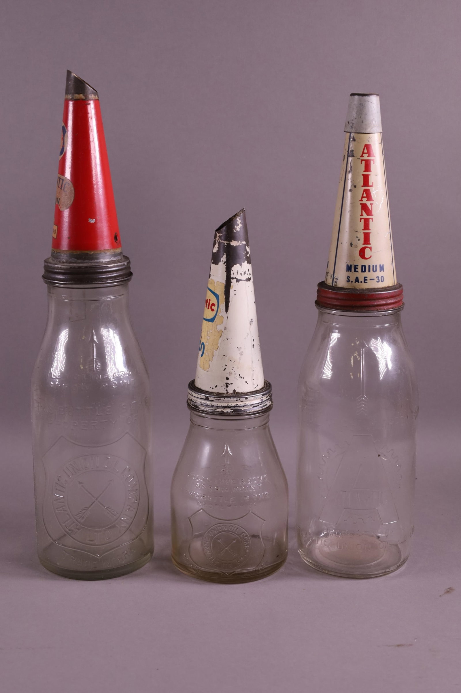 THREE ATLANTIC OIL BOTTLES (1 of 4)