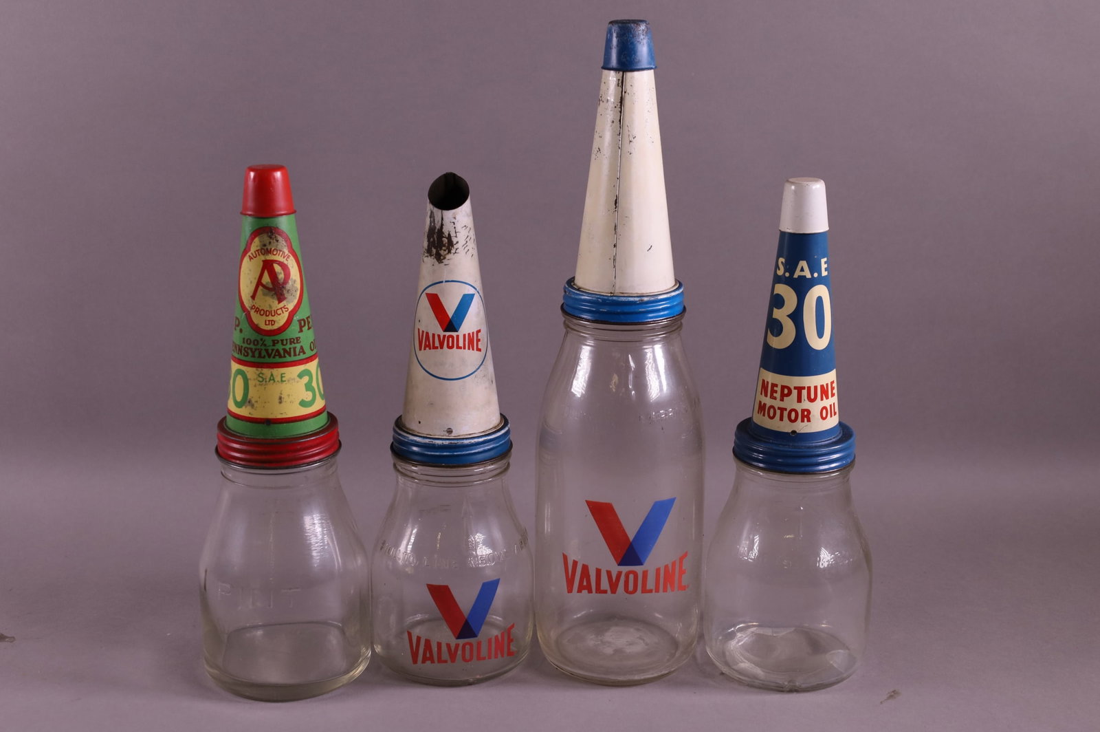 FOUR OIL BOTTLES (1 of 4)