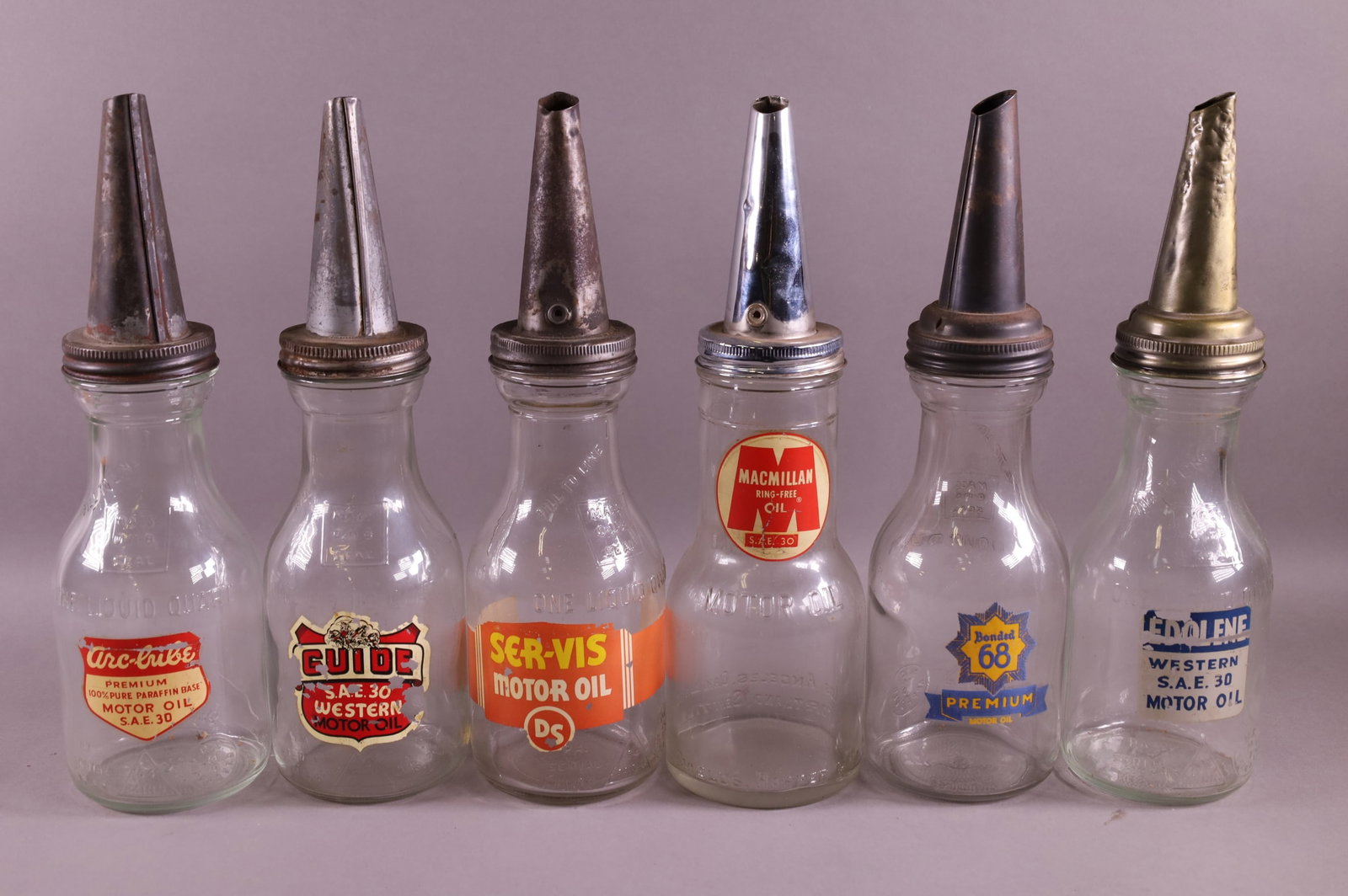 SIX OIL BOTTLES (1 of 3)