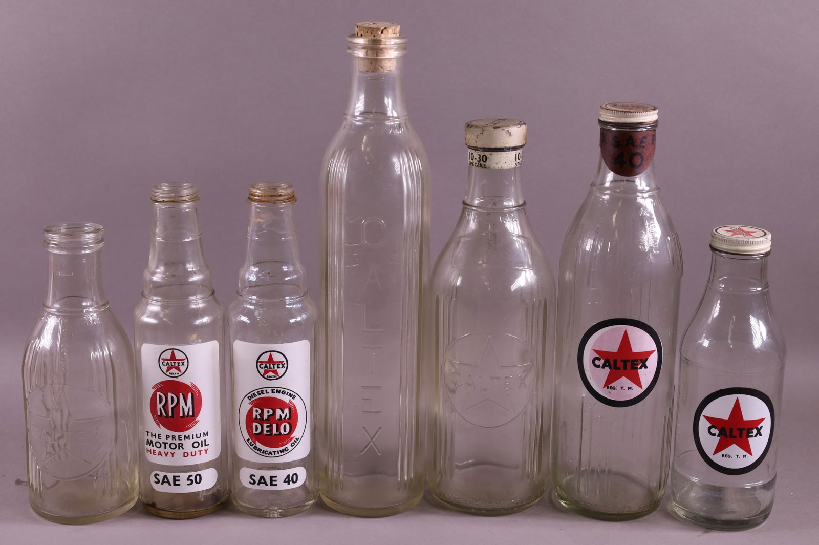 SEVEN CALTEX OIL BOTTLES (1 of 3)
