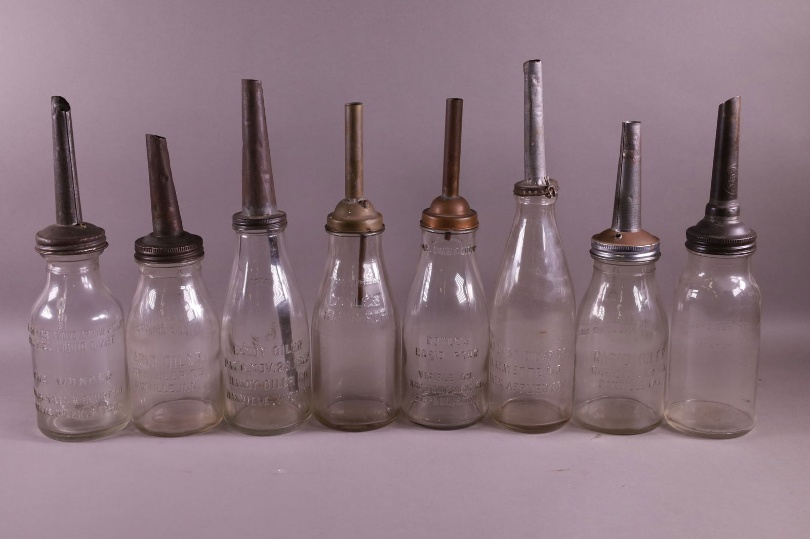 EIGHT DOYLE'S OIL BOTTLES (1 of 4)