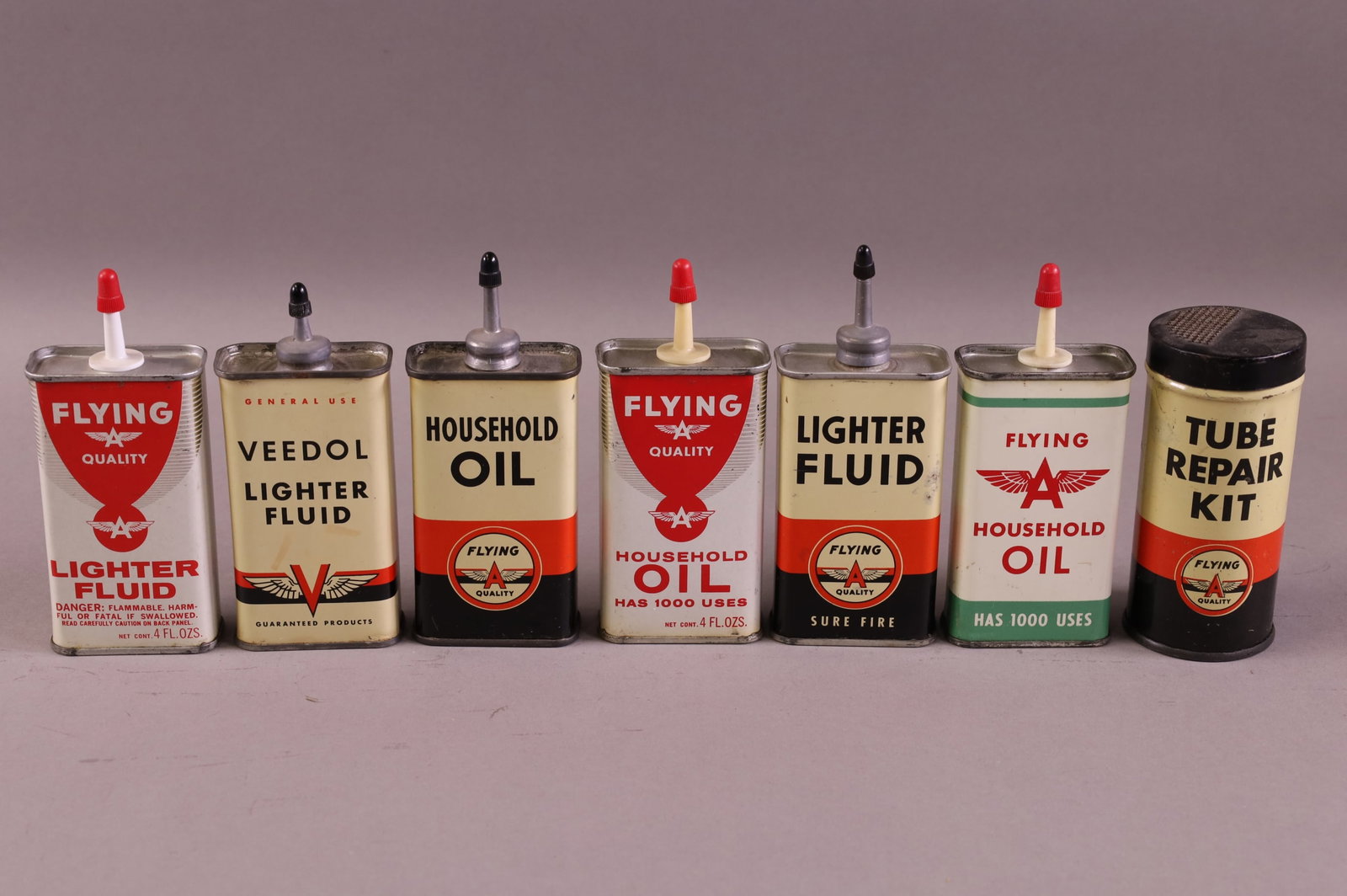 SEVEN FLYING A OIL & TUBE CANS (1 of 3)