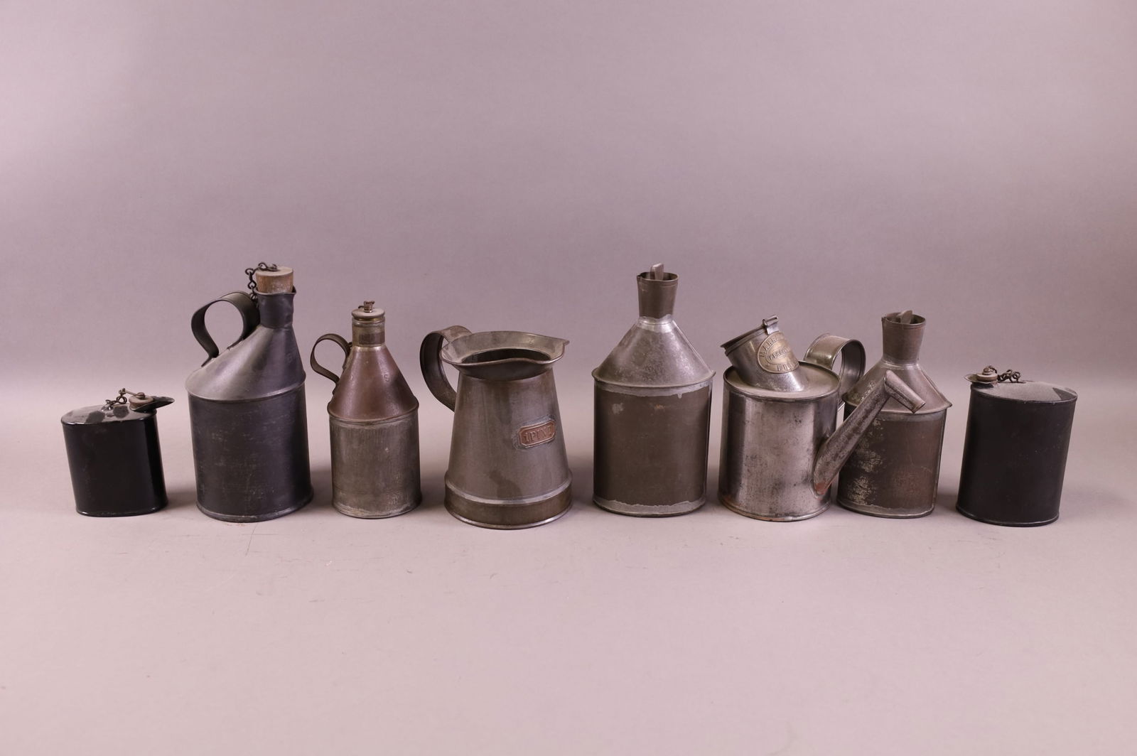 EIGHT ANTIQUE OIL PITCHERS (1 of 3)