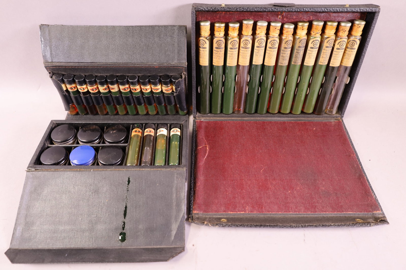 TWO SALESMAN SAMPLE OIL BOTTLE SETS (1 of 4)
