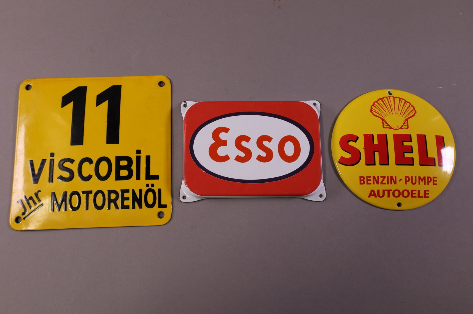 THREE FOREIGN PORCELAIN SIGNS (1 of 2)