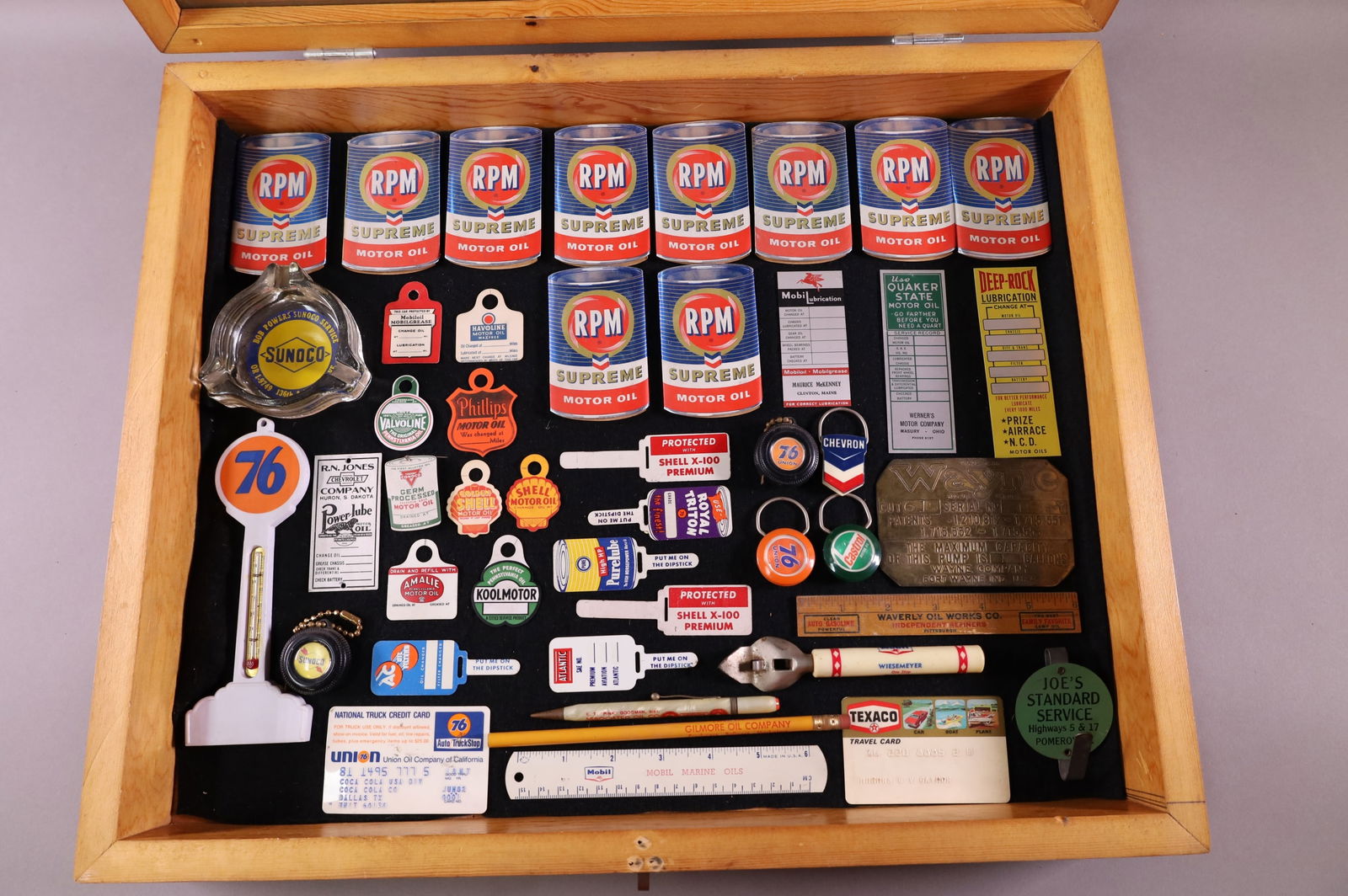 SHOWCASE OF OIL & GAS EPHEMERA: KEYCHAINS, NOTEPADS, ASHTRAYS, RULERS. AND MORE. SHOWCASE NOT INCLUDED.