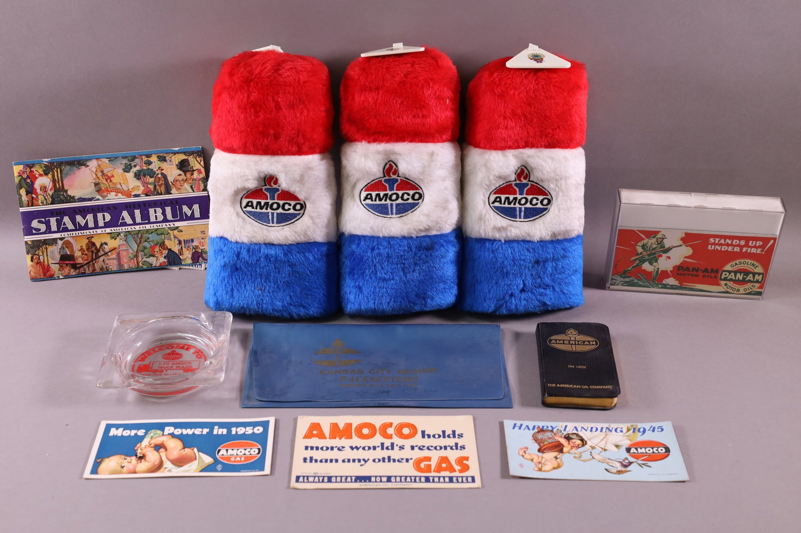 LOT OF AMOCO ITEMS: GOLF CLUB COVERS, PAPER ITEMS.