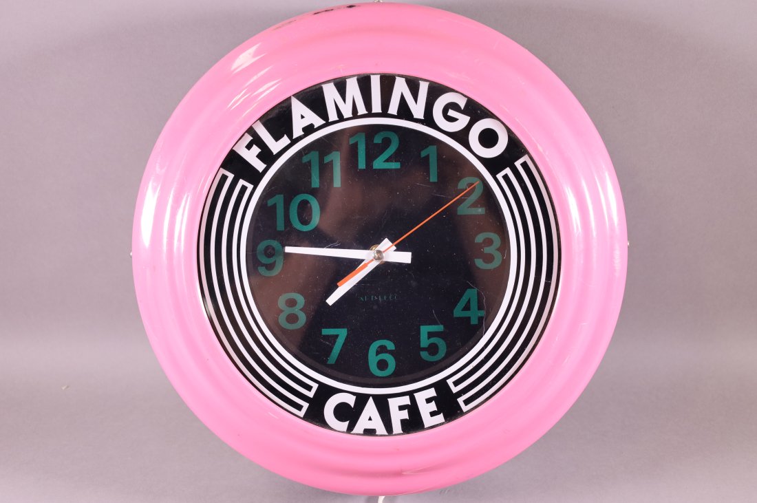 MODERN FLAMINGO CAFE NEON CLOCK: DATED 1988. 14" DIAMETER. BATTERY OP. MOVEMENT. UNKNOWN WORKING ORDER.