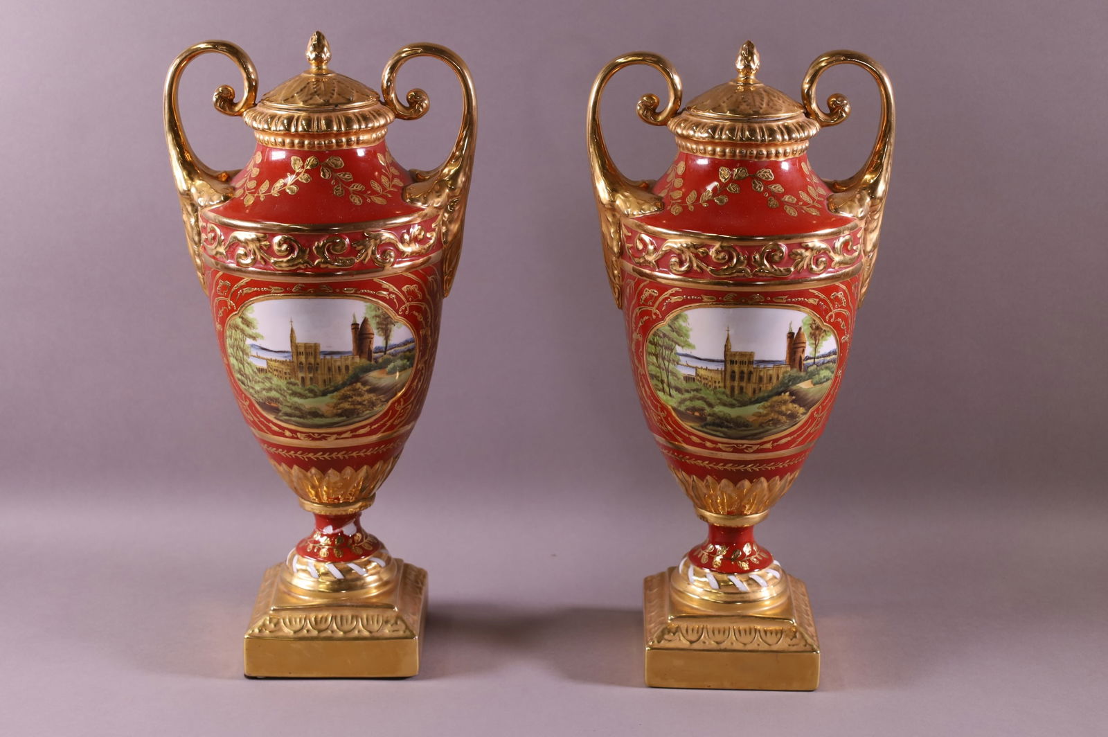 PAIR OF PORCELAIN 2 HANDLED URNS (1 of 3)