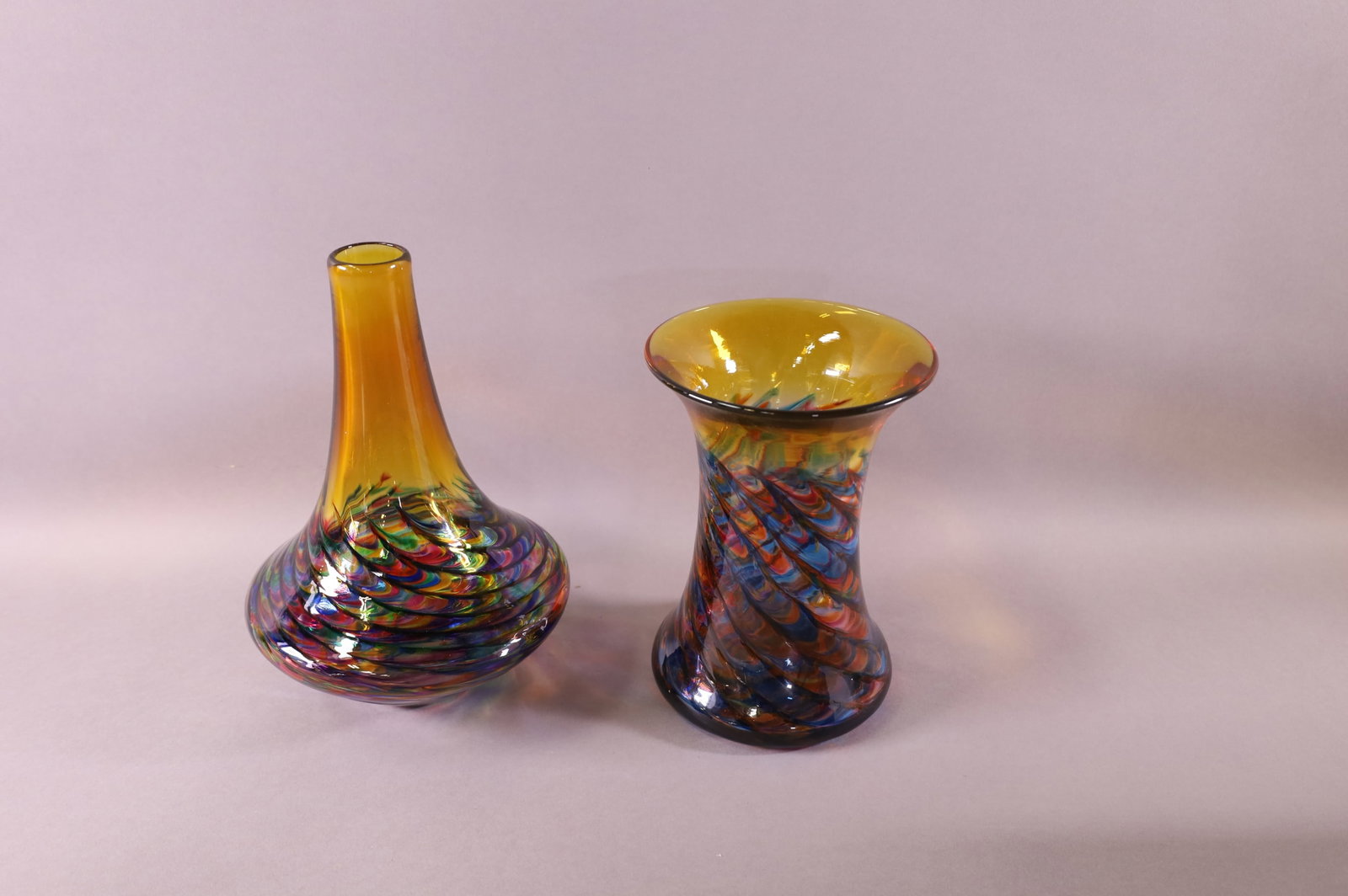 TWO MICHAEL TRIMEOL ART GLASS VASES: IN ORIGINAL BOXES. SIGNED MICHAEL TRIMEOL. GOOD CONDITION. 9" & 7 1/2" H