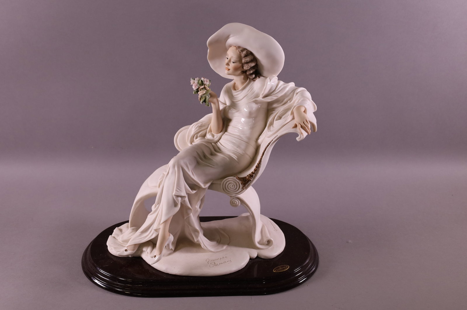 GIUSEPPE ARMANI PORCELAIN FIGURE: DATED 1994, FLORENCE. TITLED AT EASE. GOOD CONDITION. 14" W x 14" H.
