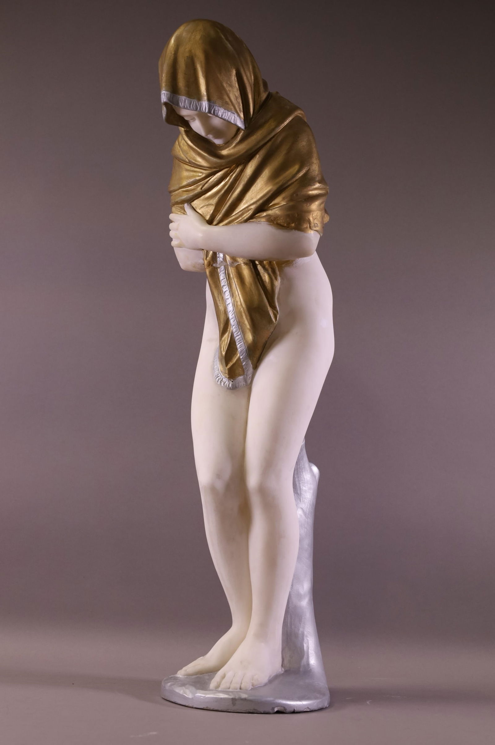 LARGE ALABASTER STATUE OF A WOMAN: SIGNED ON REVERSE, HOUDON. PAINTED FINISH. REPAIR AT MID BODY. 28" H. THIS ITEM EXCEEDS SIZE LIMITATIONS FOR IN HOUSE SHIPPING.