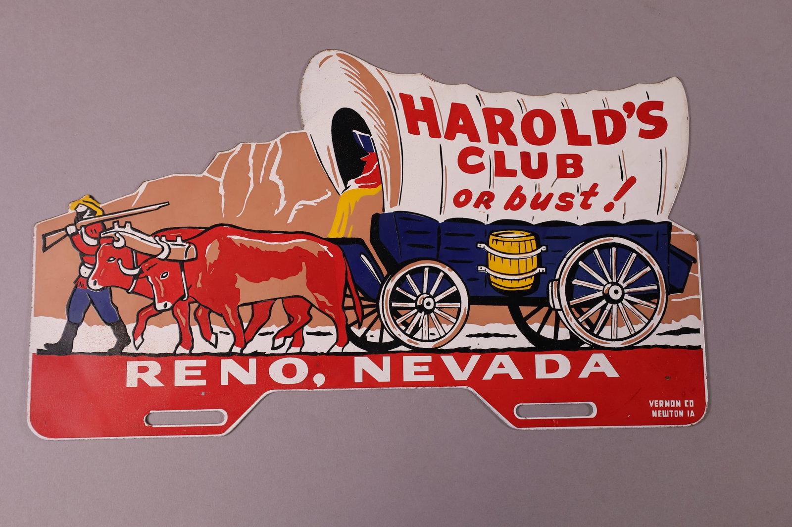 HAROLD'S CLUB RENO TIN LICENSE PLATE TOPPER: HAROLD'S CLUB RENO, NEVADA TIN LICENSE PLATE TOPPER. GOOD CONDITION. 14" W x 8" H
