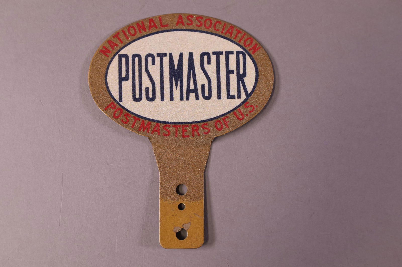 POSTMASTER TIN LICENSE PLATE TOPPER (1 of 2)