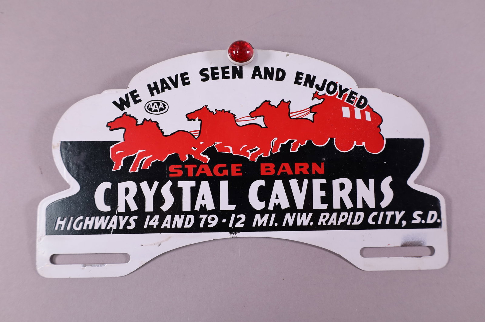 CRYSTAL CAVERNS TIN LICENSE PLATE TOPPER: STAGE BARN CRYSTAL CAVERNS RAPID CITY SOUTH DAKOTA TIN LICENSE PLATE TOPPER. LIGHT SURFACE SCRATCHES. 10" W x 5 1/4" H