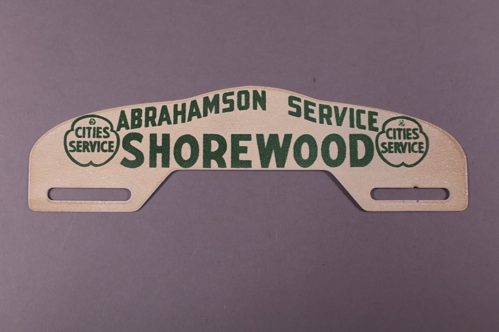 CITIES SERVICE TIN LICENSE PLATE TOPPER: SHOREWOOD CITIES SERVICE TIN LICENSE PLATE TOPPER. GOOD CONDITION. 10" W x 2 3/4" H