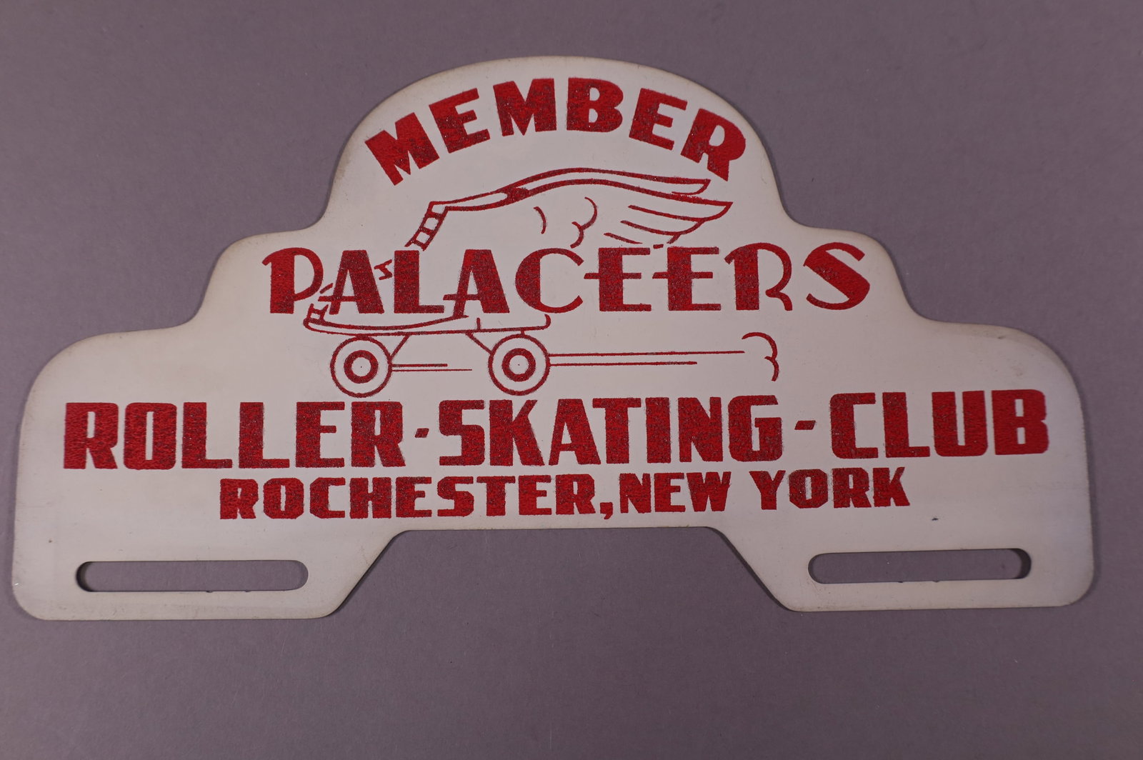 PALACEERS TIN LICENSE PLATE TOPPER: PALACEERS ROLLER SKATING CLUB ROCHESTER NEW YORK TIN LICENSE PLATE TOPPER. GOOD CONDITION. 11" W x 6" H.