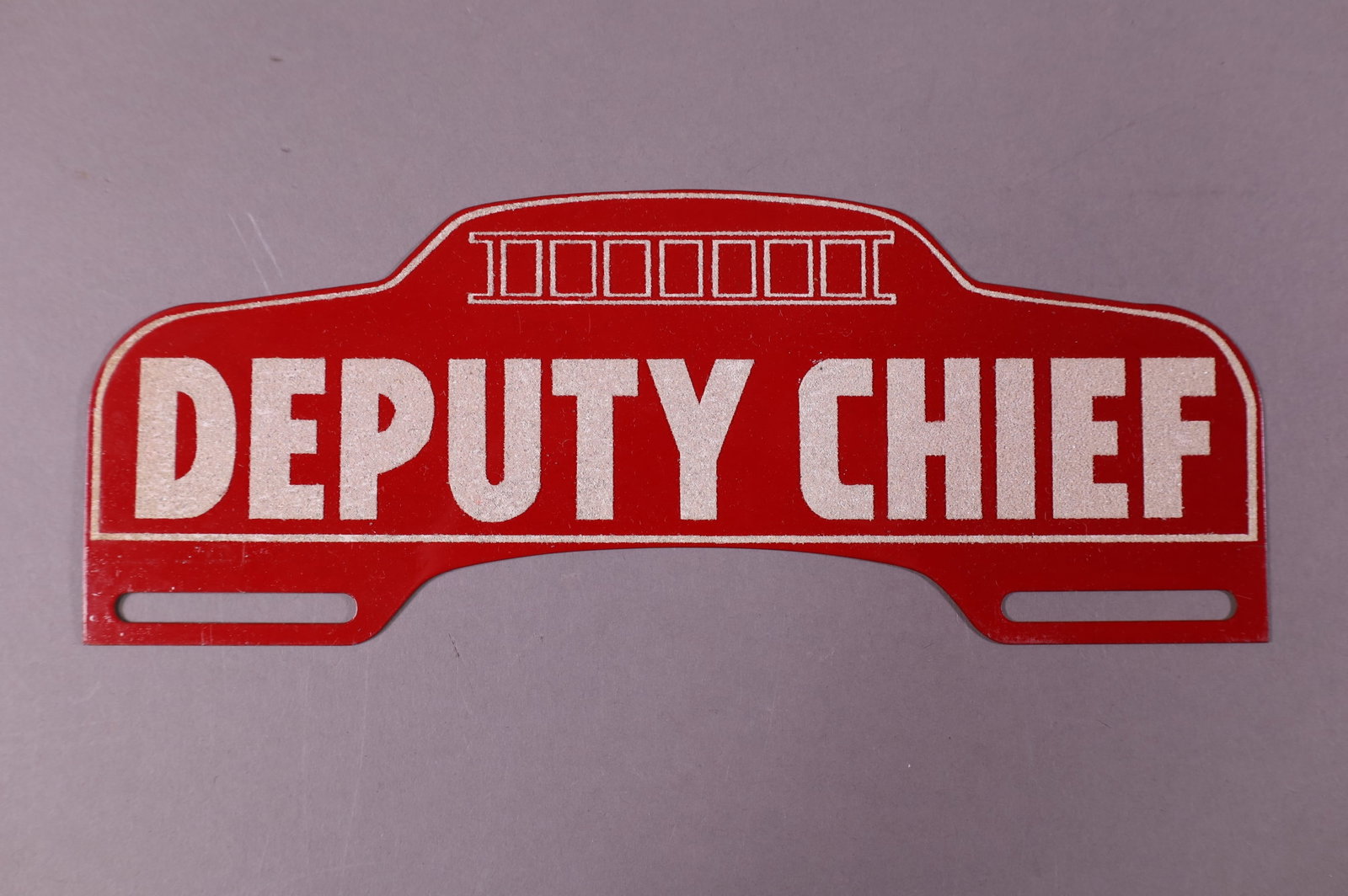 DEPUTY CHIEF TIN LICENSE PLATE TOPPER: DEPUTY CHIEF TIN LICENSE PLATE TOPPER. GOOD CONDITION. 10" L x 4" H