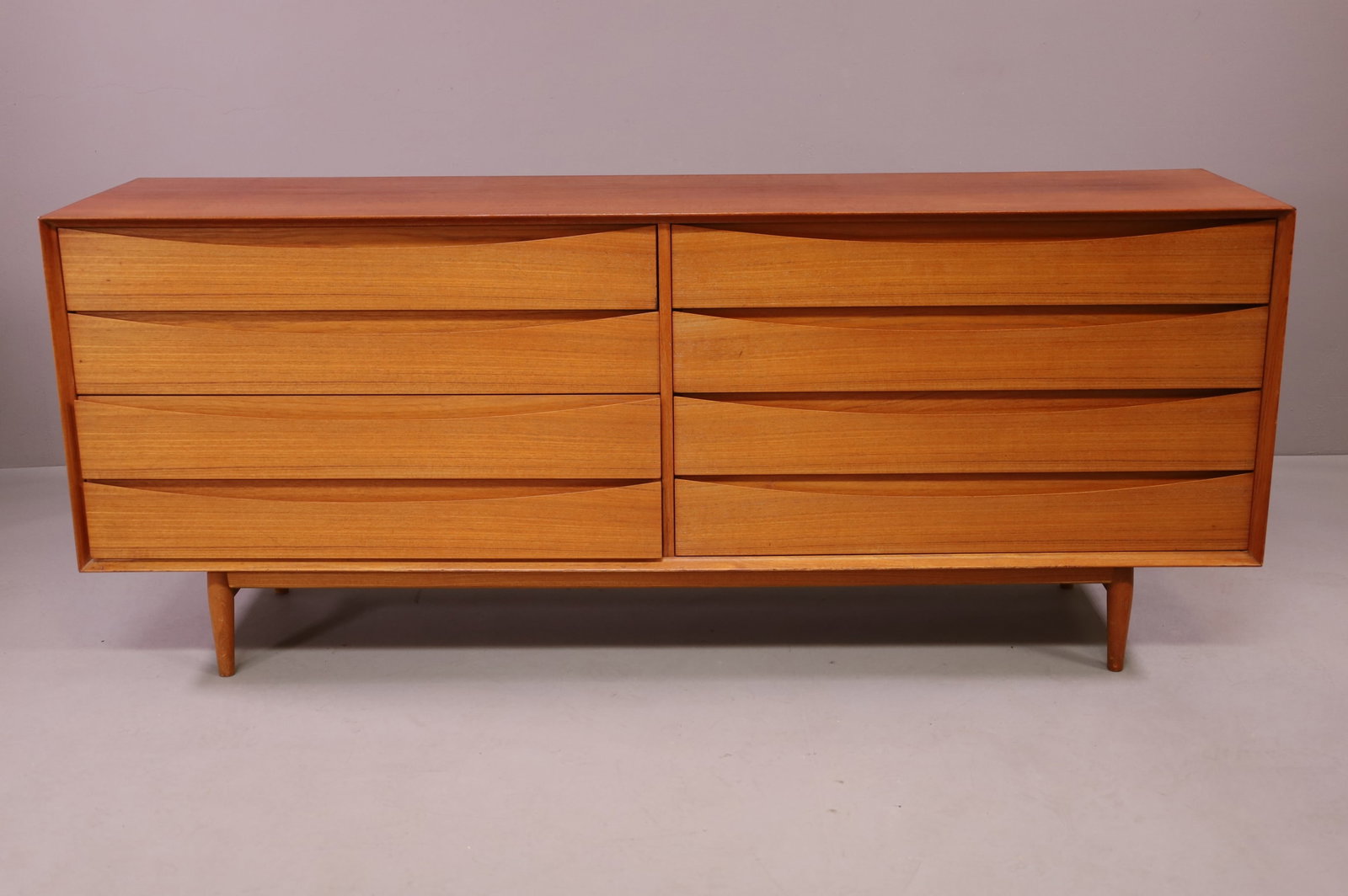 DANISH MODERN DRESSER BY ARNE VODDER: EIGHT DRAWER DANISH MODERN DRESSER BY ARNE VODDER FOR SIBAST. MARKED IN DRAWER. GOOD CONDITION. 77 1/2" W x 19 1/2" D x 31 1/2" H. THIS ITEM EXCEEDS SIZE LIMITATIONS FOR IN HOUSE SHIPPING.