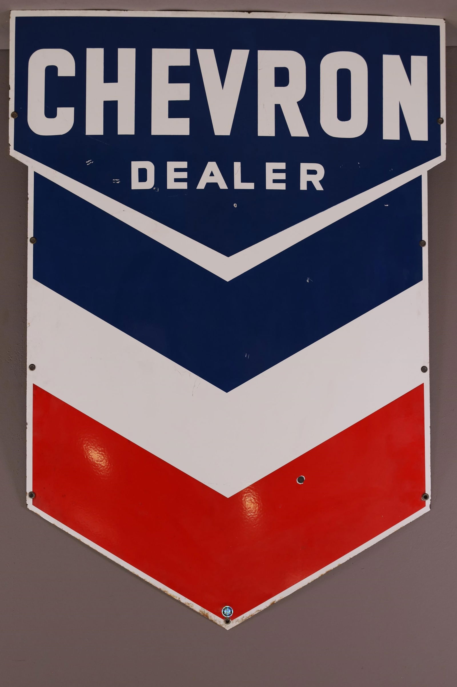 Chevron Dealer Porcelain Sign (TAC): rated 8.5, 53.5"x38.5", the SSP diecut sign has excellent color and gloss, has a few small chips in the field. TAC #044238. This lot exceeds size limitations for in house shipping.