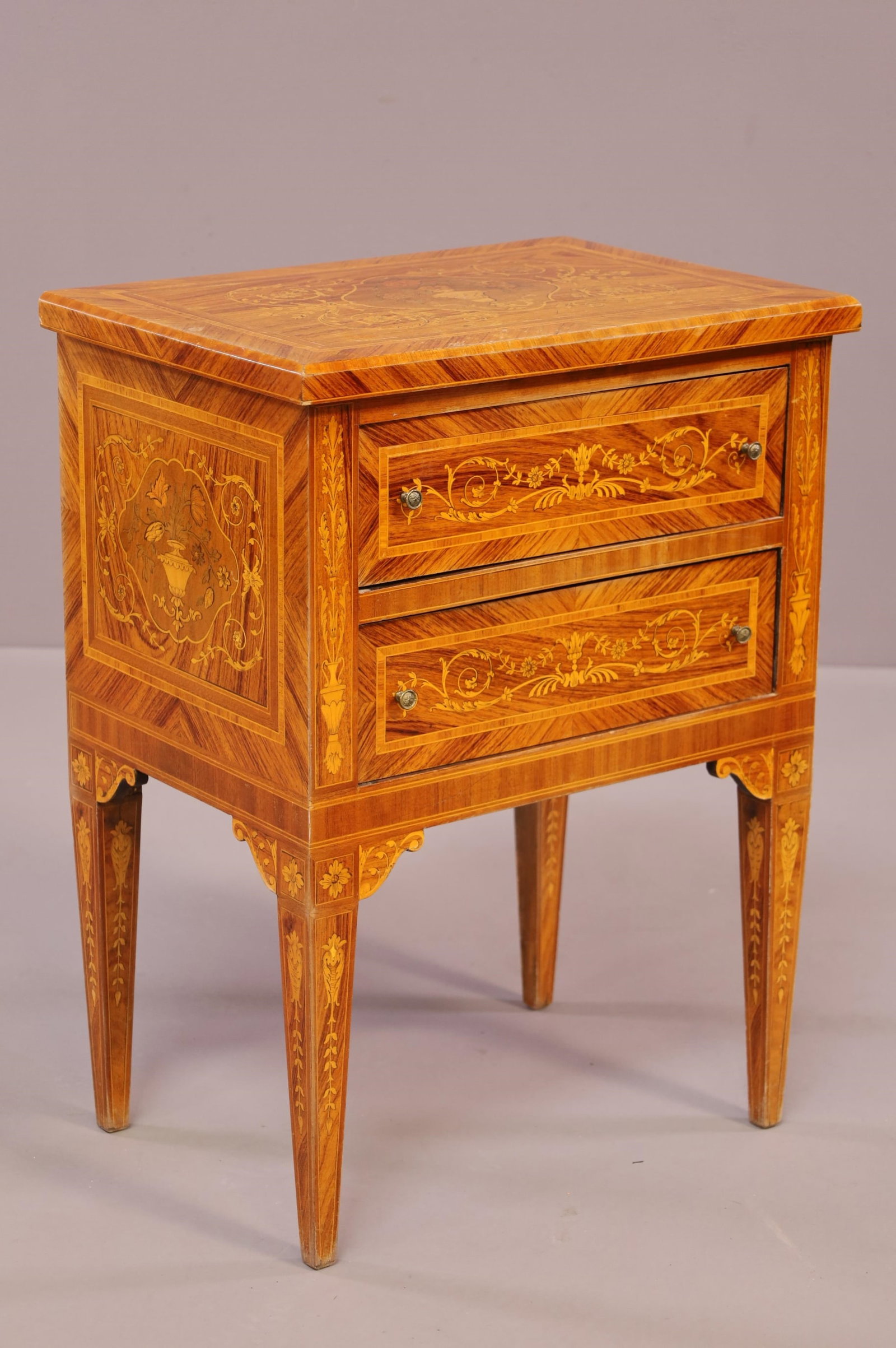 FRENCH INLAID NIGHTSTAND: TWO DRAWER, INLAID NIGHTSTAND, FLOWER BASKET PATTERN INLAY. MINOR WEAR TO FINISH. 21" W x 14" D x 27 1/2" H. THIS ITEM EXCEEDS SIZE LIMITATIONS FOR IN HOUSE SHIPPING.