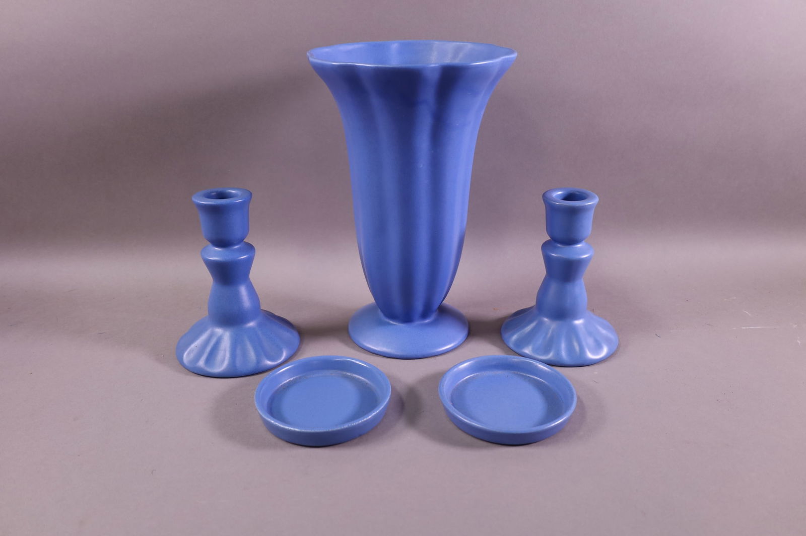 FIVE PIECES OF CATALINA POTTERY: BLUE GLAZED VASE, 10" H. PAIR OF CANDLESTICKS, 5" H. PAIR OF COASTERS, 4" DIAM.
