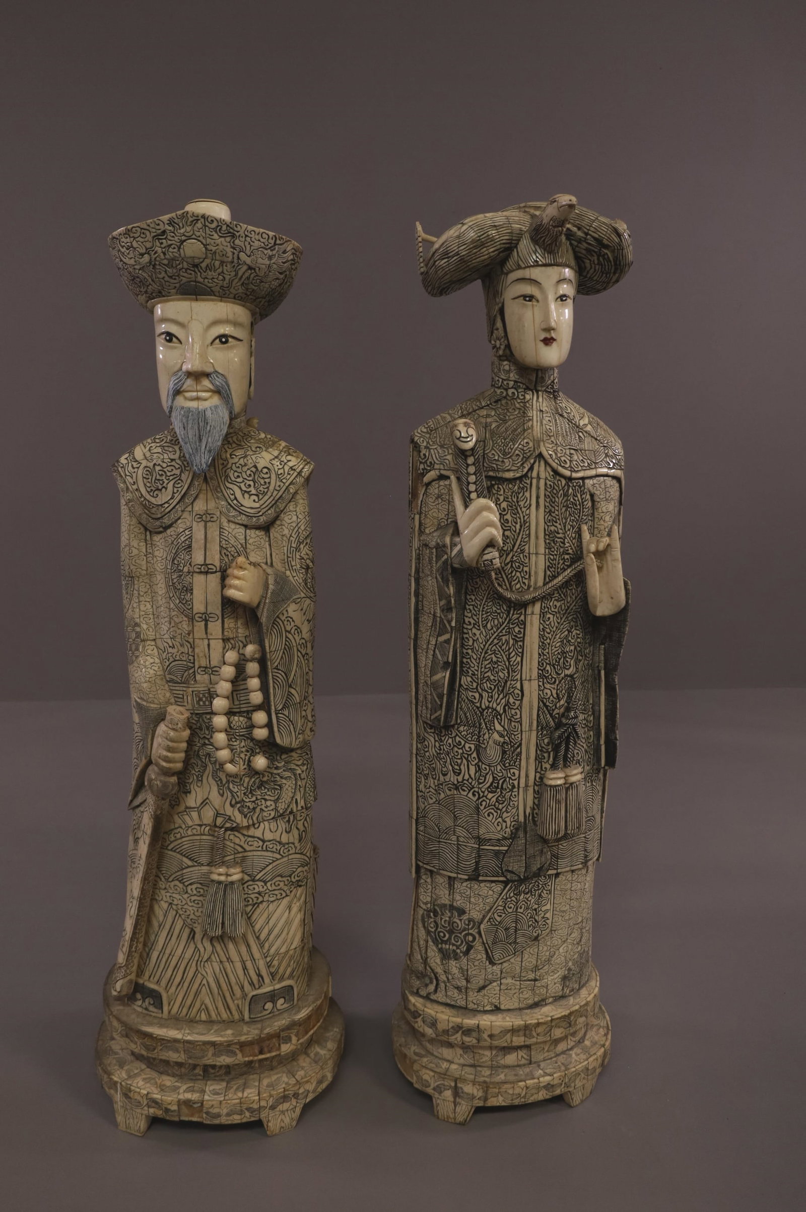 TWO LARGE CHINESE BONE STATUES: LARGE BONE APPLIED FIGURES, EMPEROR & EMPRESS. LOOSE AND MISSING PIECES. 41" H. THIS ITEM EXCEEDS SIZE LIMITATIONS FOR IN HOUSE SHIPPING.