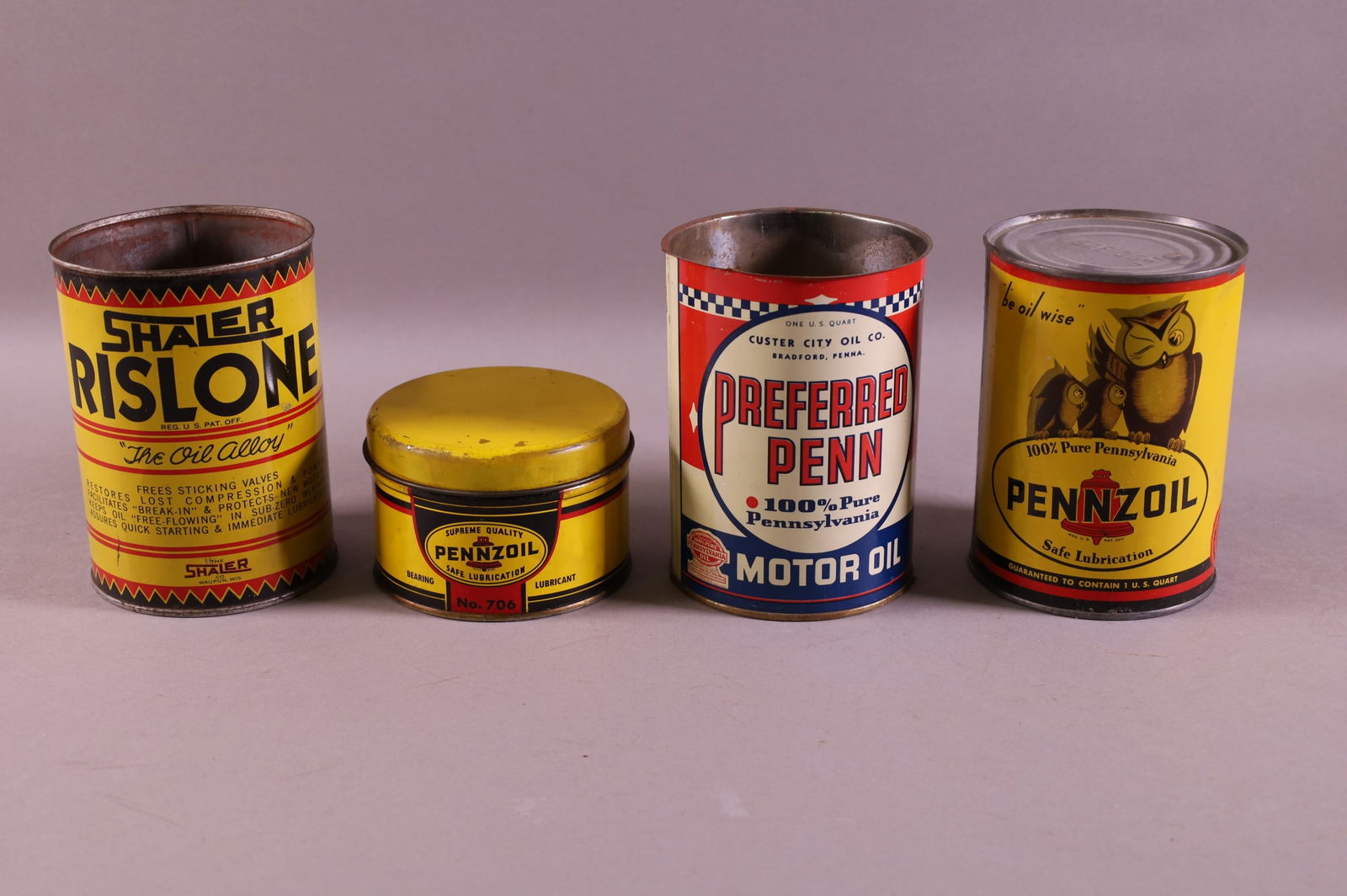 FOUR OIL RELATED CANS (1 of 2)