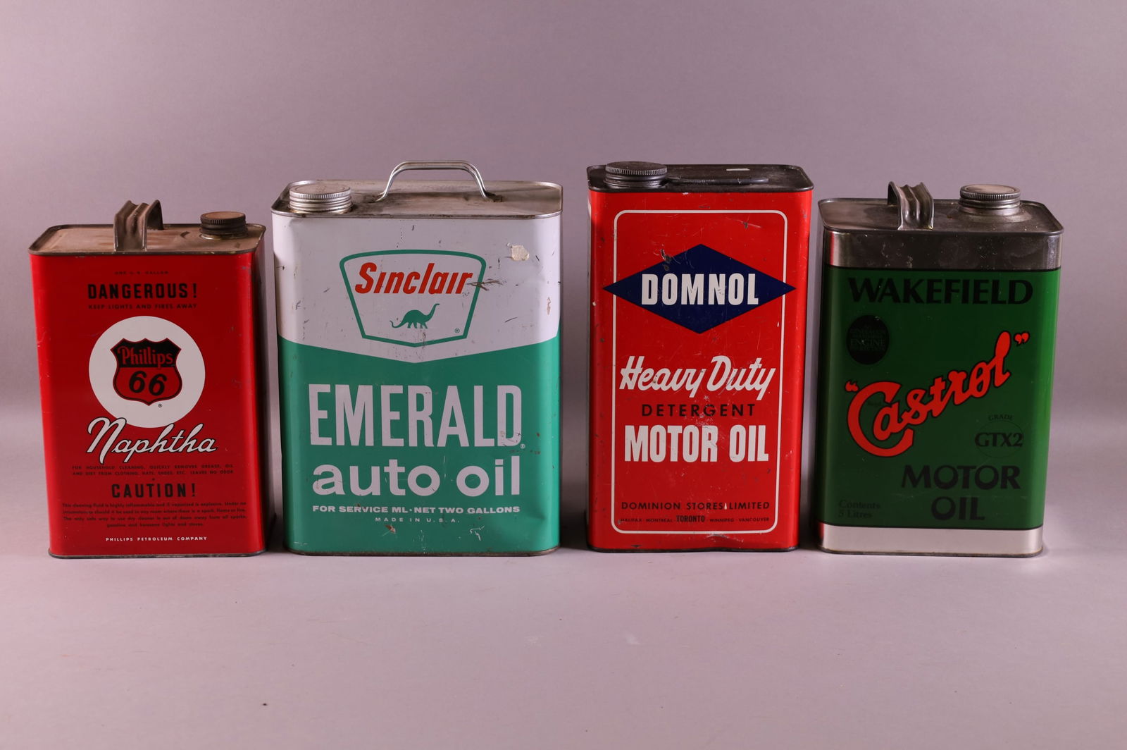 FOUR OIL CANS (1 of 2)