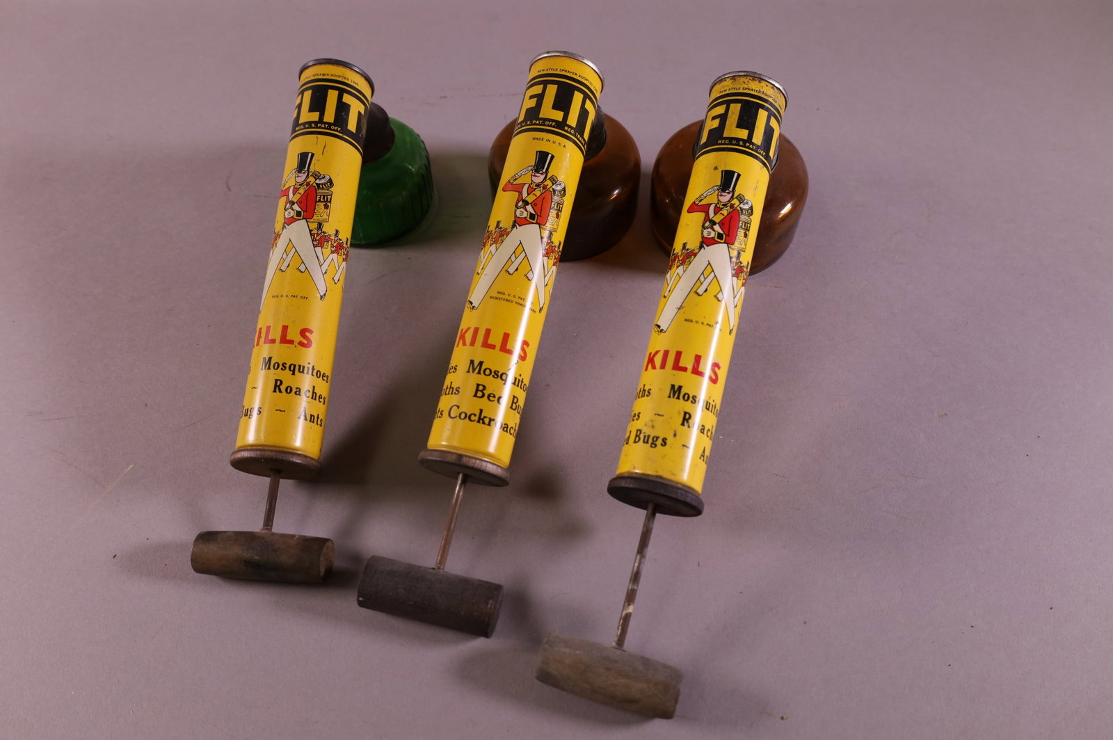 THREE FLIT SPRAYERS: WITH GLASS CONTAINERS.
