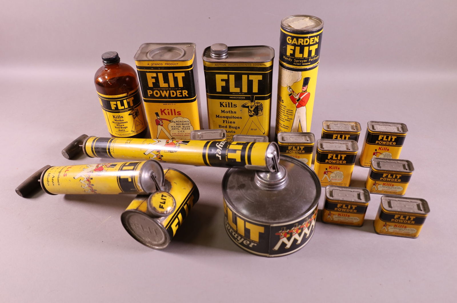 LARGE LOT OF FLIT ITEMS: CANS, BOTTLE, SPRAYERS.