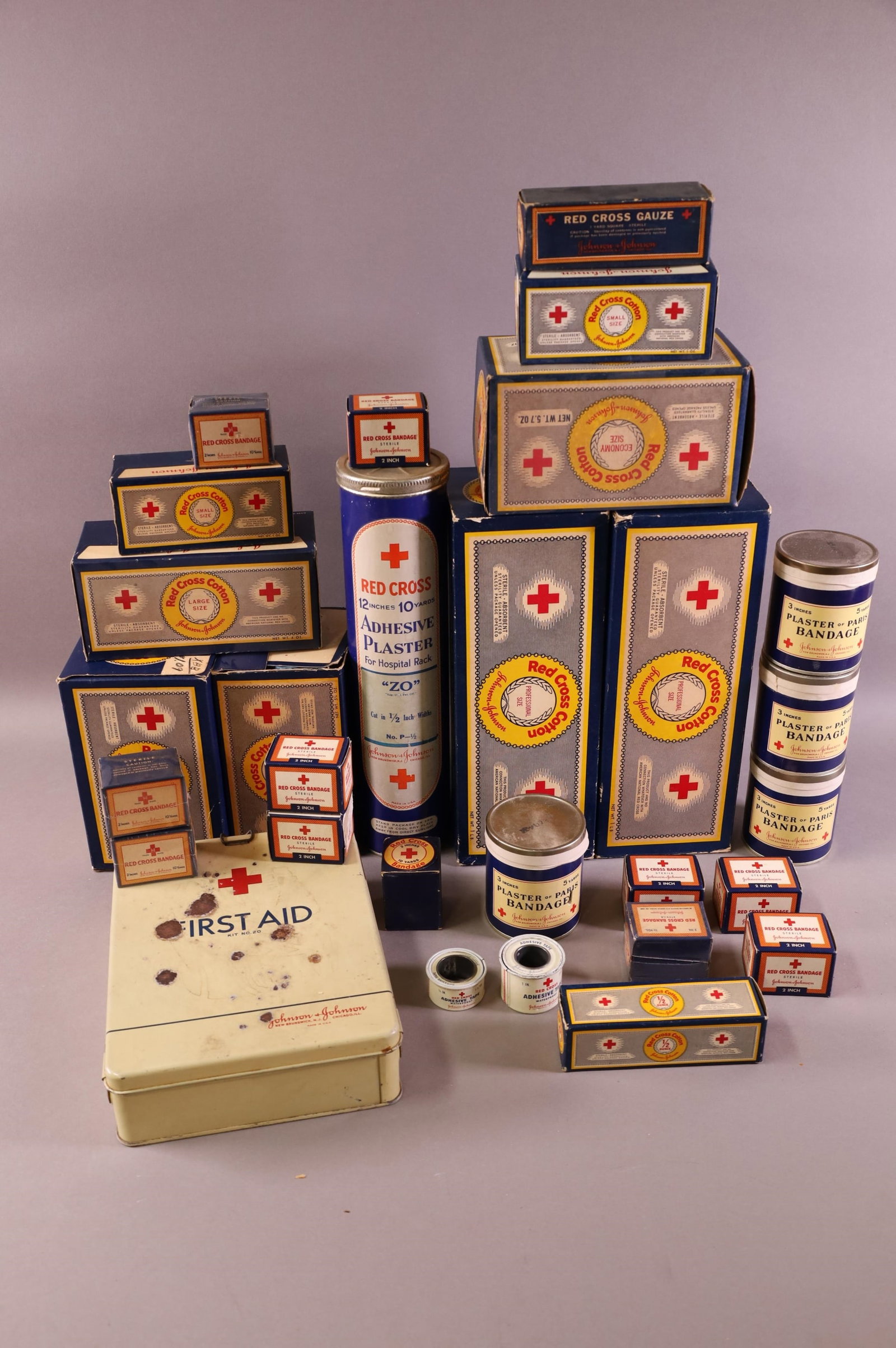 COLLECTION OF RED CROSS ITEMS: TINS, BOXES, & MORE.
