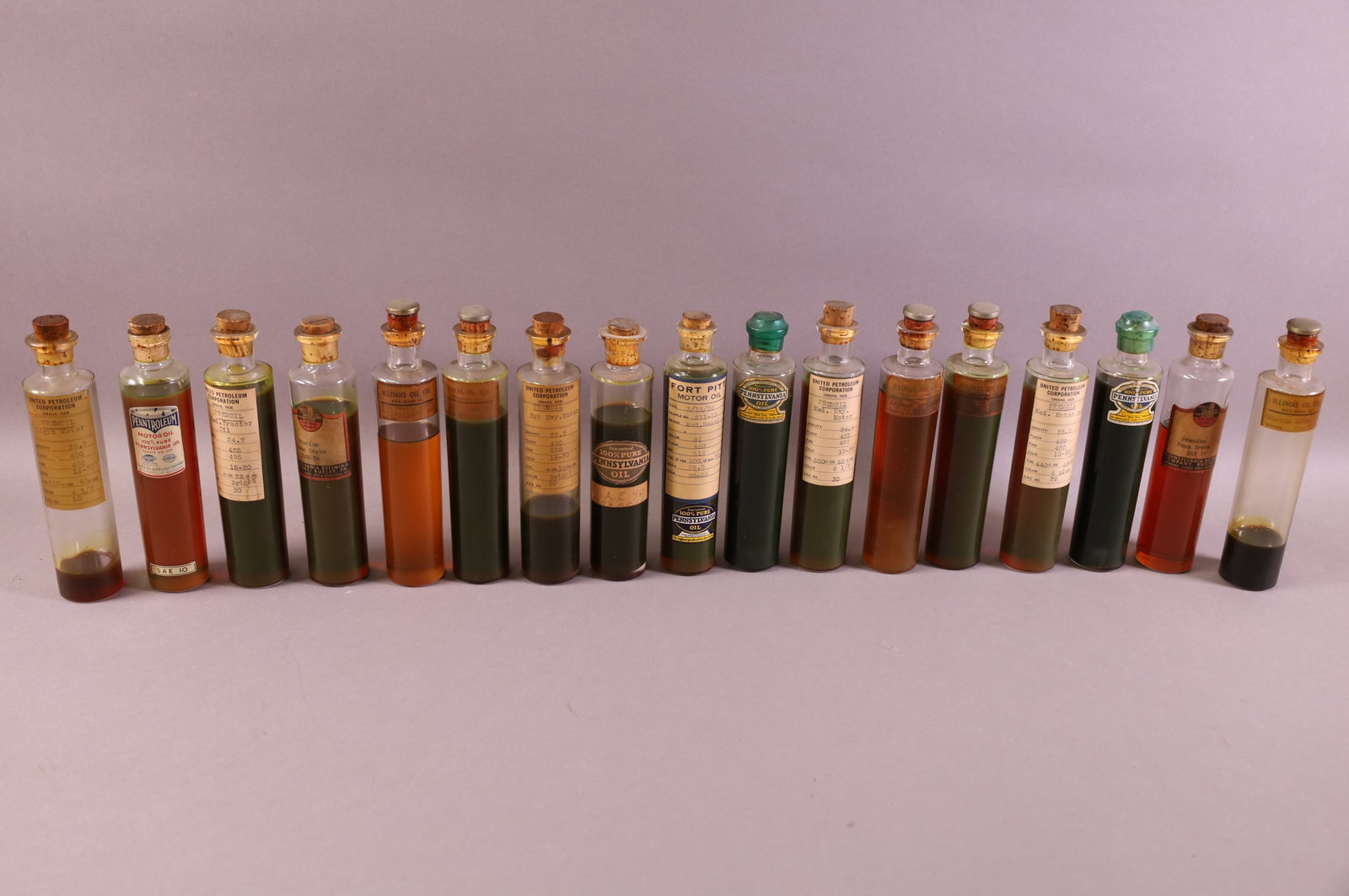 17 SALESMAN SAMPLE OIL BOTTLES: PENN. & ILLINOIS OIL CO.