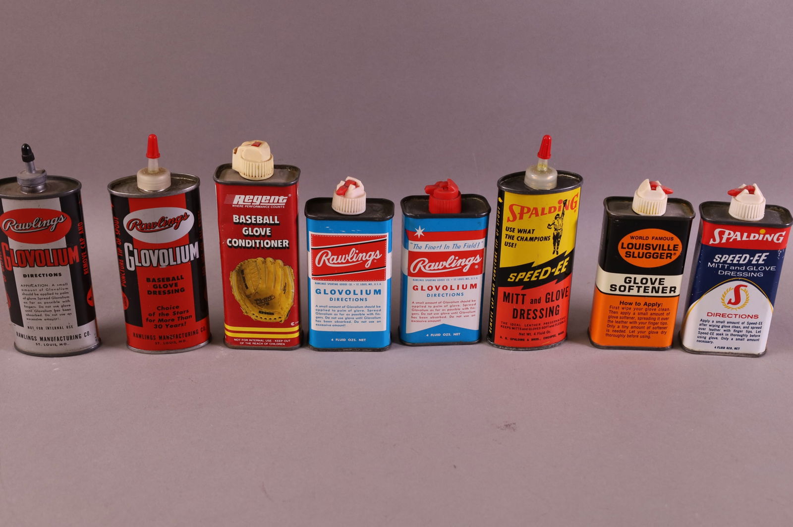 EIGHT BASEBALL GLOVE OIL CANS (1 of 1)