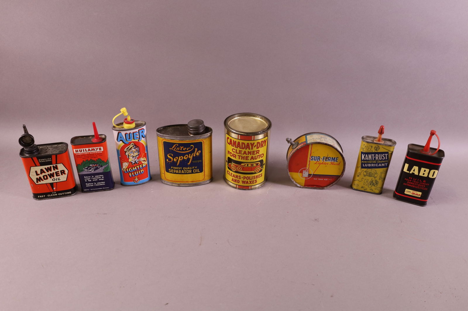 EIGHT ANTIQUE OIL CANS (1 of 1)
