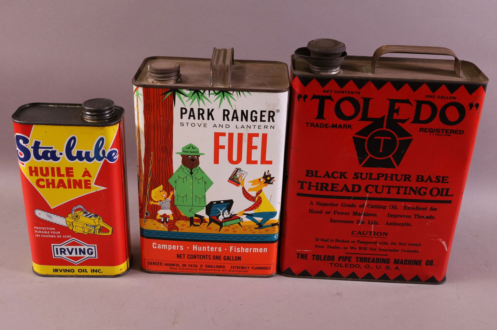 THREE OIL CANS (1 of 2)