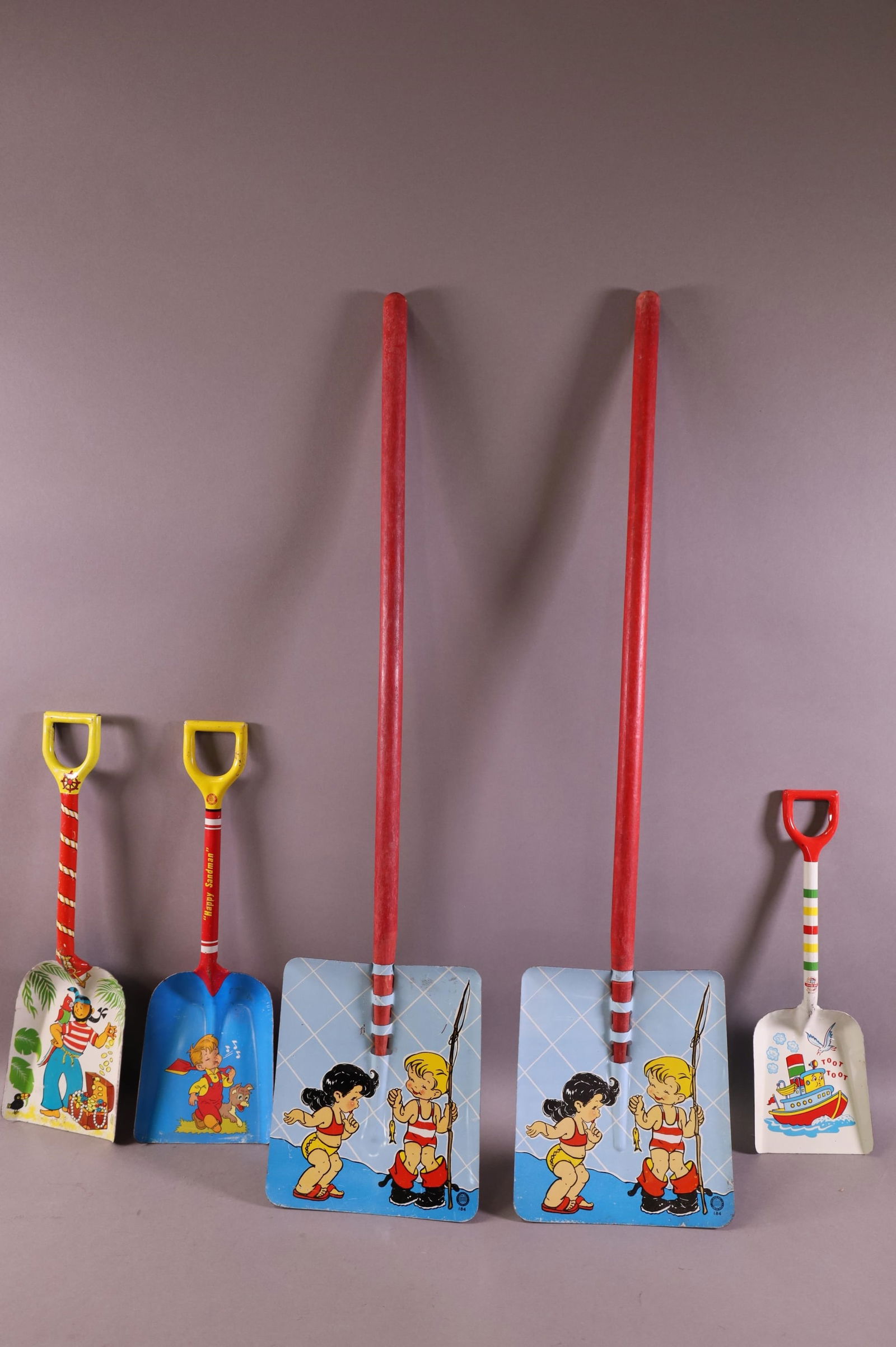 FIVE TIN LITHO CHILD'S SHOVELS (1 of 3)