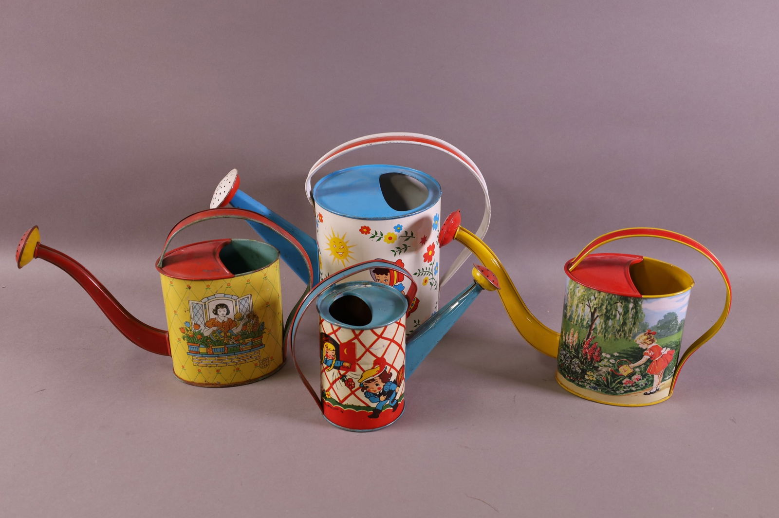 FOUR TIN LITHO WATERING PAILS (1 of 3)