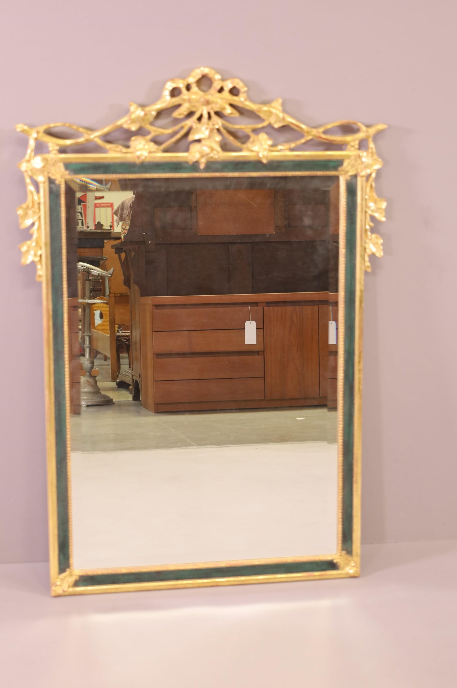 GILT WOOD WALL MIRROR: BEVELED WALL MIRROR, GILT TOP. MINOR LOSS TO GILT. 31" x 45" THIS ITEM EXCEEDS SIZE LIMITATIONS FOR IN HOUSE SHIPPING.