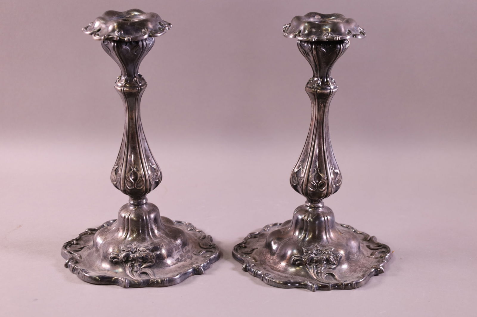 PAIR OF VICTORIAN SILVERPLATED CANDLESTICKS (1 of 2)