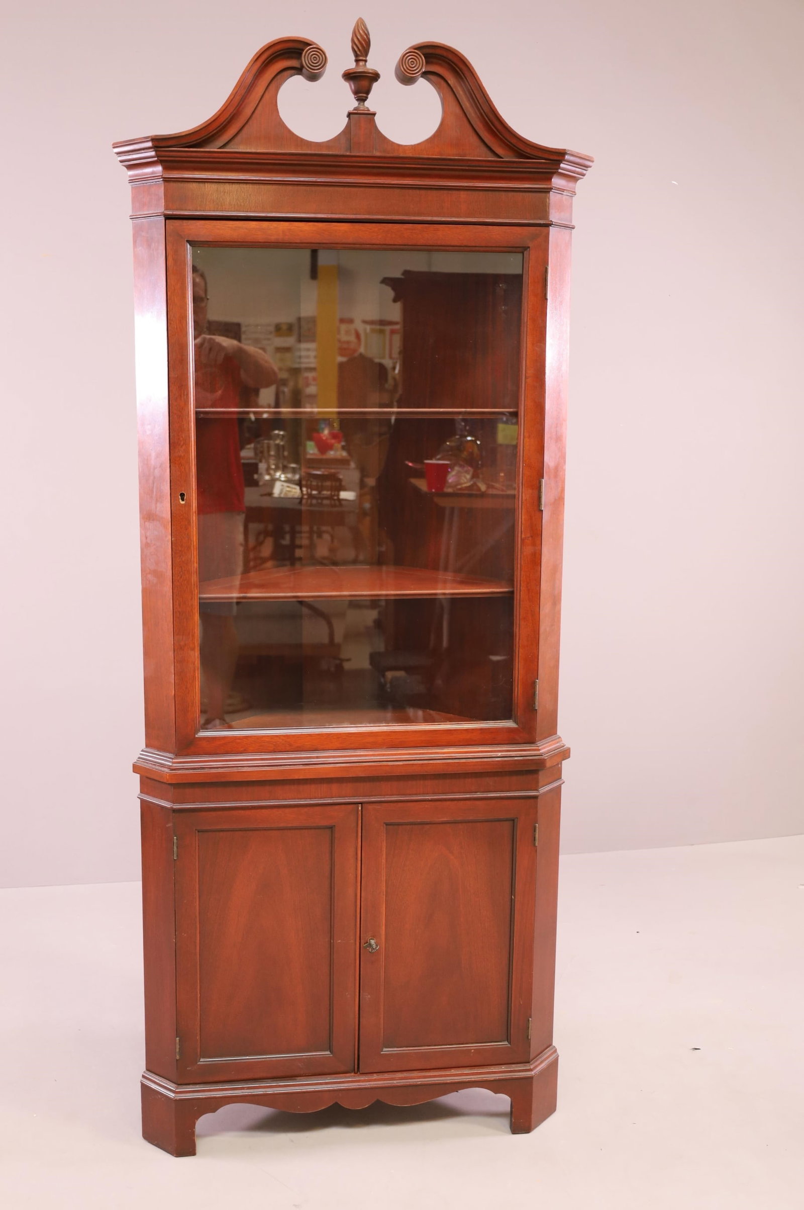 SINGLE DOOR MAHOGANY CORNER CABINET: SINGLE DOOR UPPER, TWO LOWER DOORS. MINOR WEAR TO FINISH. 30" W x 15" D x 76" H. THIS ITEM EXCEEDS SIZE LIMITATIONS FOR IN HOUSE SHIPPING.