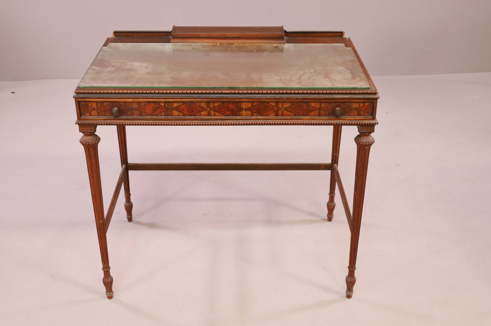 1920'S SINGLE DRAWER LADY'S DESK: HINGED LID INKWELL TOP, SINGLE DRAWER, GLASS TOP. WEAR TO FINISH, SURFACE SCRATCHES. 32" W x 19" D x 30" H. THIS ITEM EXCEEDS SIZE LIMITATIONS FOR IN HOUSE SHIPPING.