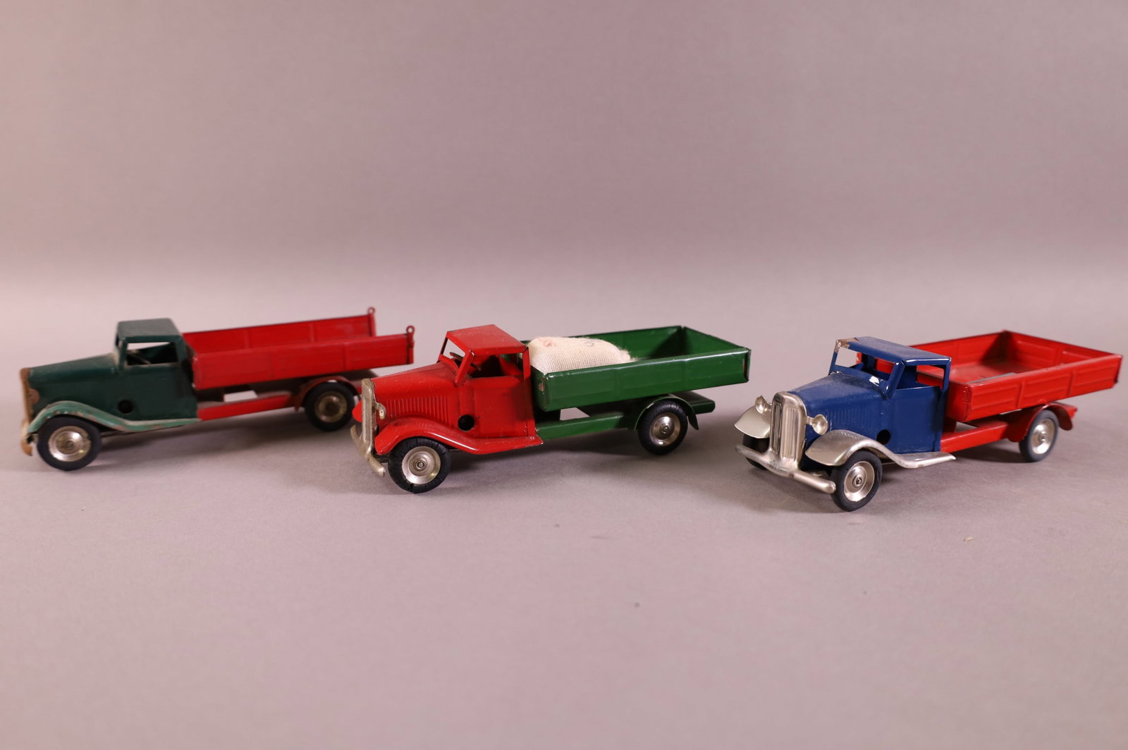 3 TRI-ANG TRUCKS: MINIC TOYS. PLAYED WITH CONDITION.
