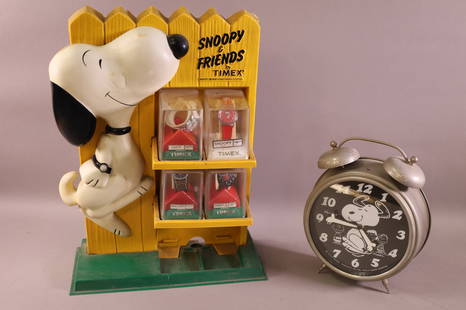 2 SNOOPY ITEMS: OVERSIZED ALARM CLOCK, DATED 1970. & SNOOPY AND FRIENDS TIMEX WATCH DISPLAY. MISSING TWO LOWER WATCHES. THIS ITEM EXCEEDS SIZE LIMITATIONS FOR IN HOUSE SHIPPING.