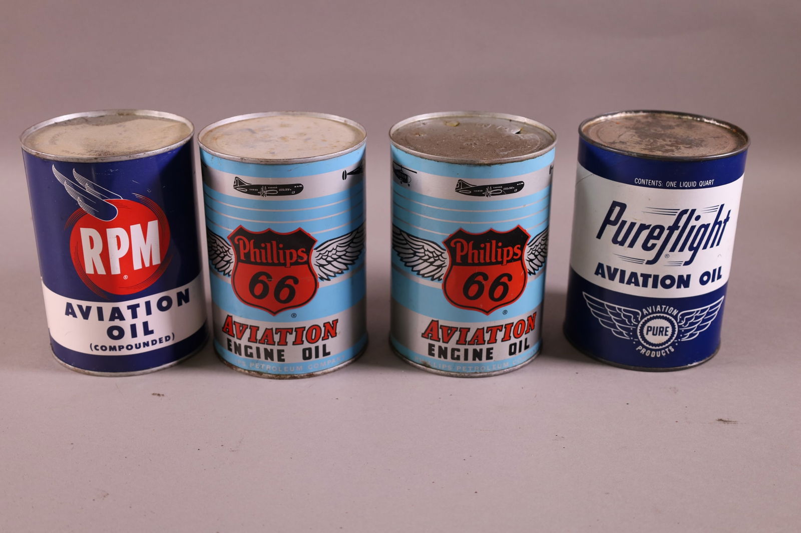 FOUR OIL CANS (1 of 2)