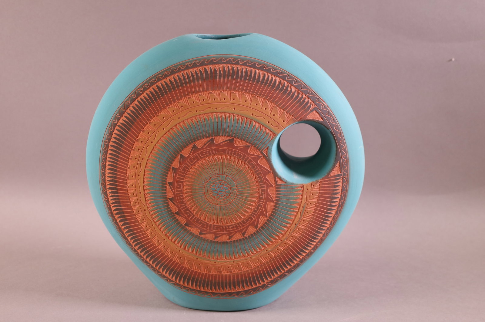 NATIVE AMERICAN PILLOW VASE: SIGNED BEGAY. SUN PATTERN, MARKED ON BASE NAVAJO. 11" H x 11" W