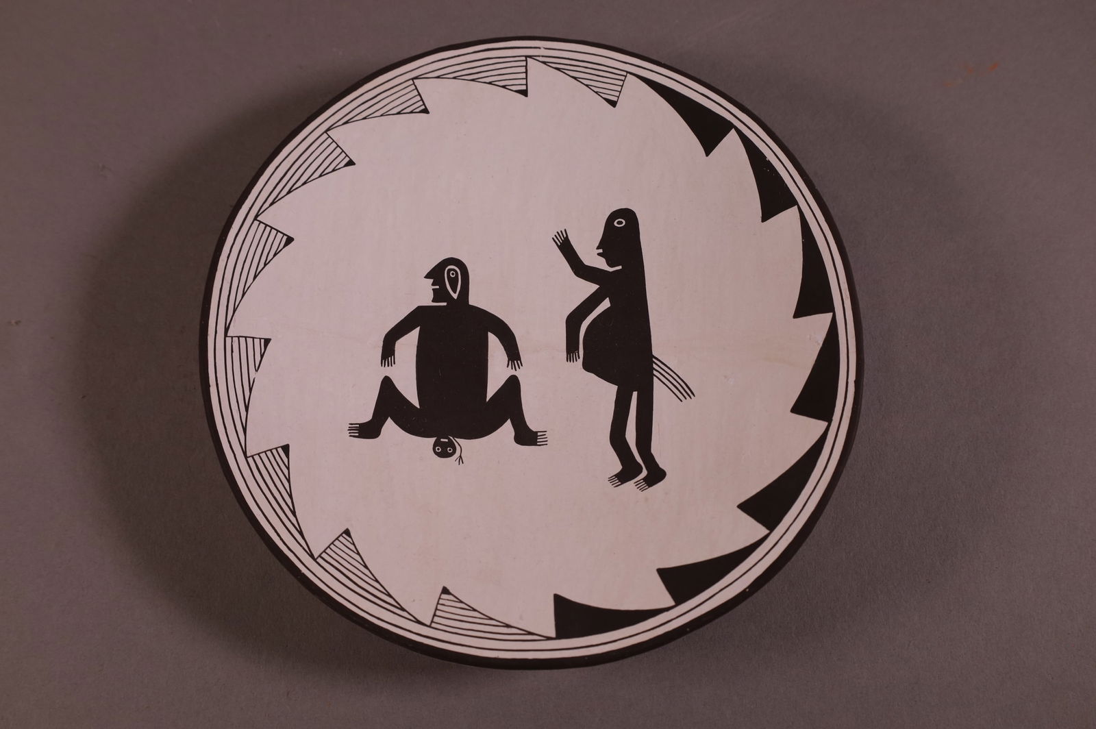 ACOMA PLATE: NATIVE AMERICAN POTTERY PLATE, ACOMA BIRTHING PLATE. MARKED EMMA LEWIS. 7" DIAM.