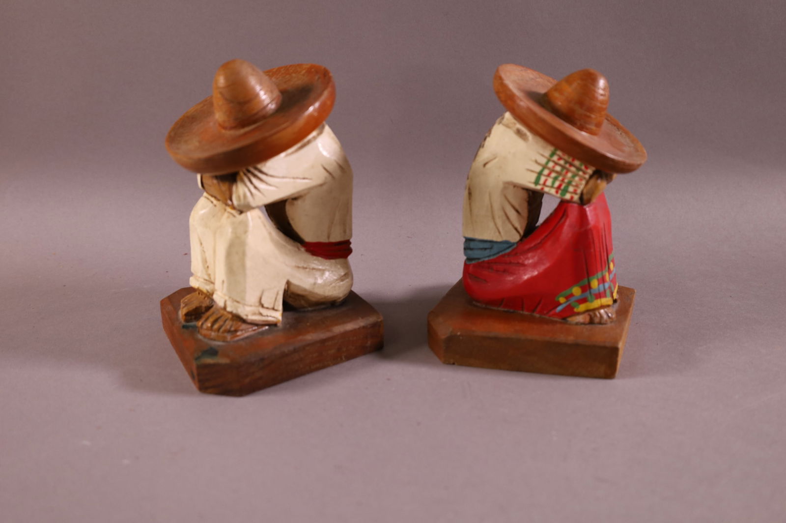 PAIR OF MAN WITH SOMBRERO BOOKENDS: MEXICAN MOTIF BOOKENDS, SIESTA CARVED WOOD BOOKENDS. PAINTED FINISH. 6" H